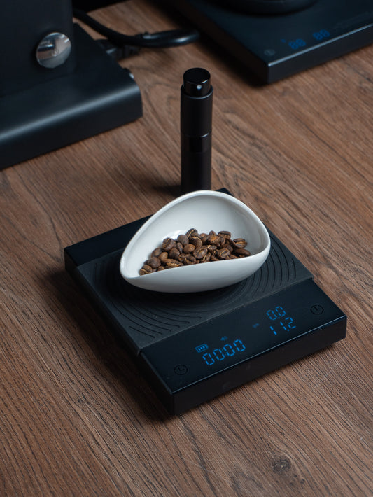 Platito y rociador para café